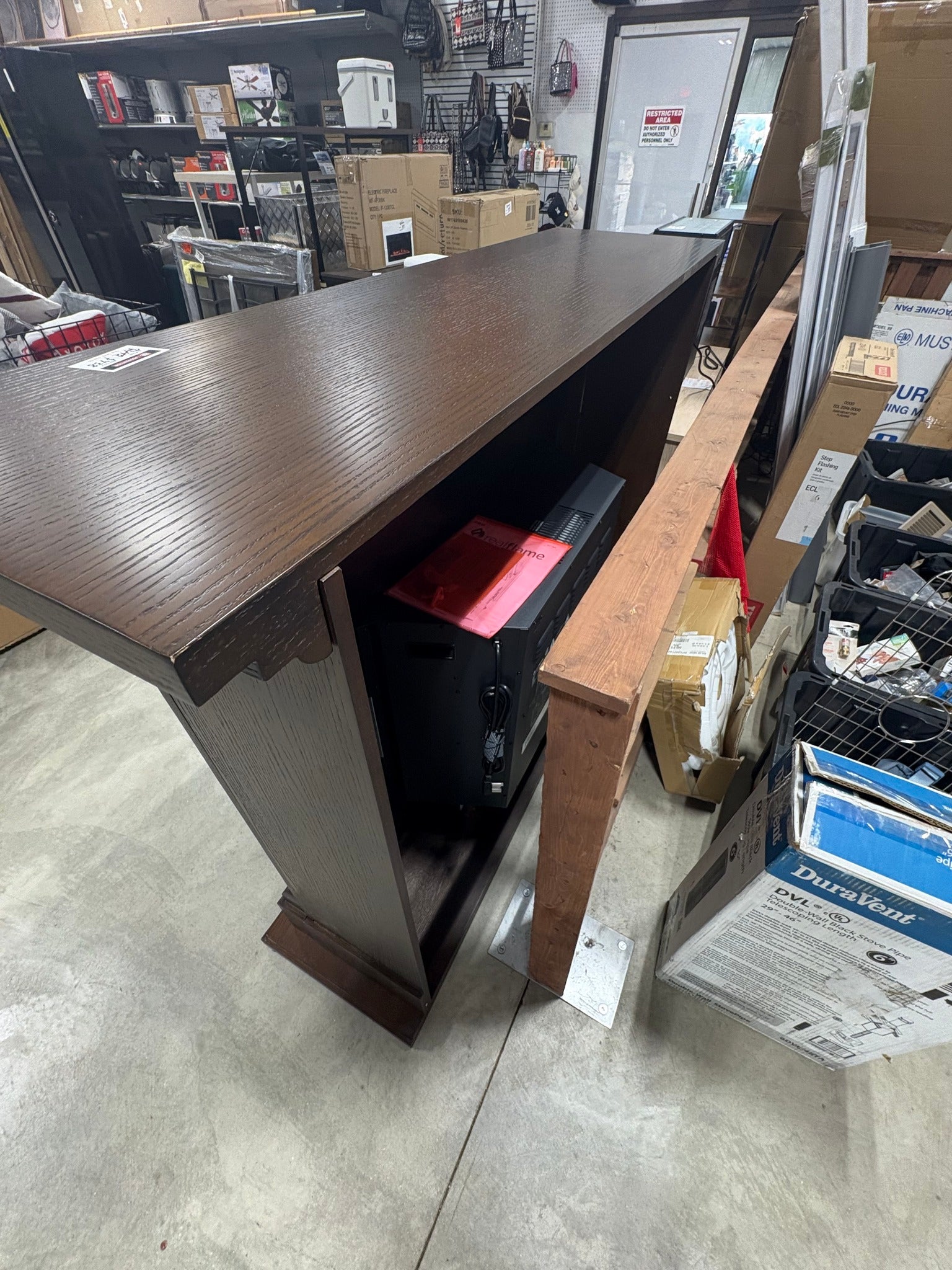 Brand new and fully assembled Real Flame Callaway 63 in. Grand Electric Fireplace in Chestnut Oak Chestnut oak finishing