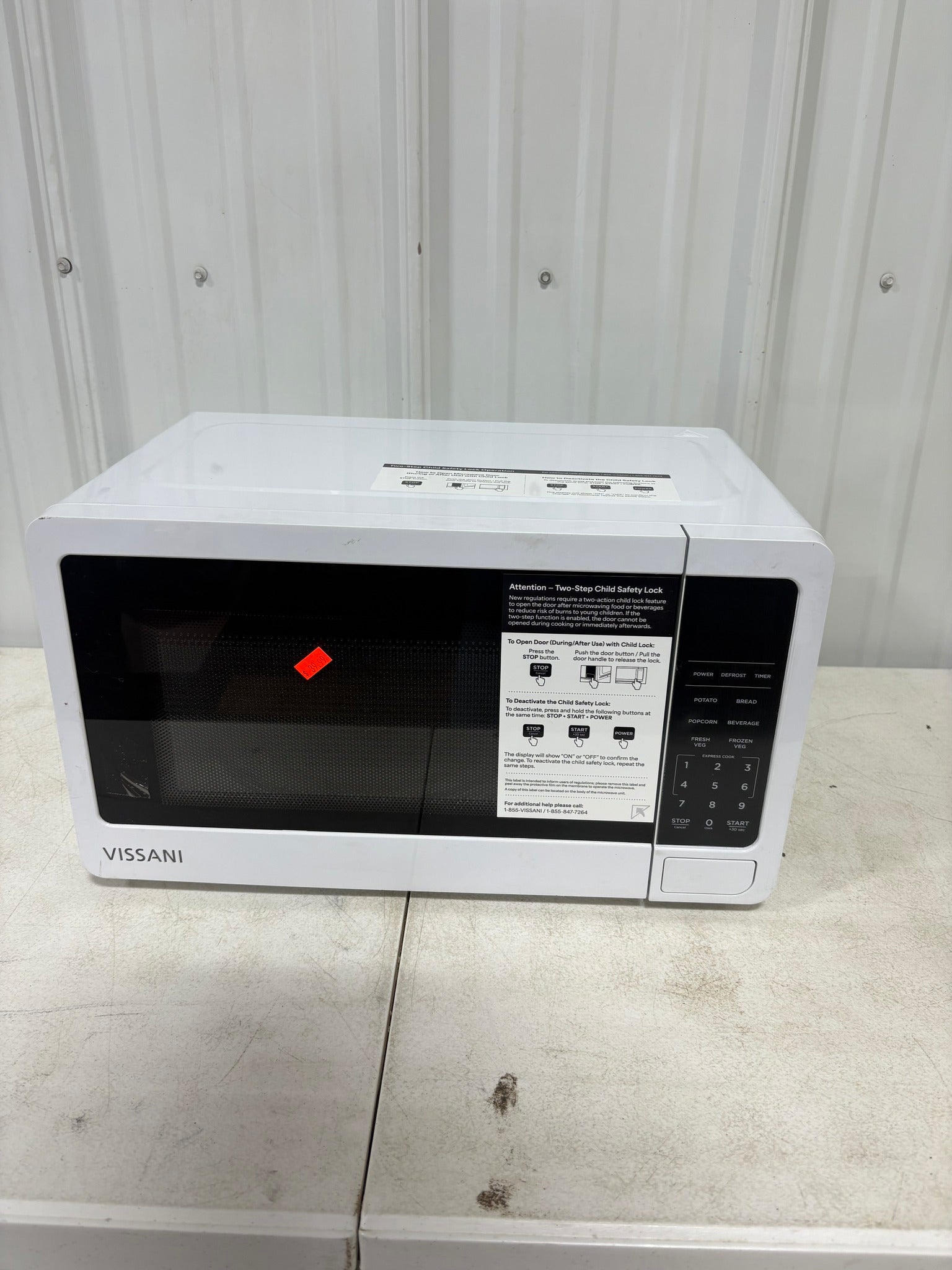 Brand new Vissani 0.7 cu. ft. Electric 700-W Countertop Microwave in White Turntable, 6-Heating Functions, and 2-Step Lock System
