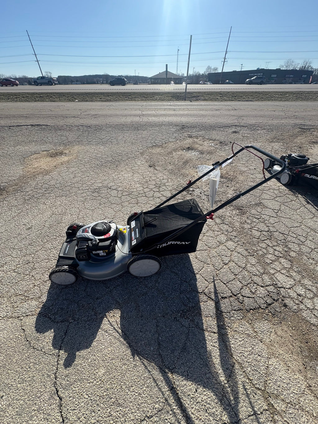 Murray 21 in. 140 cc Briggs and Stratton Walk Behind Gas Push Lawn Mower with Height Adjustment and with Mulch Bag.