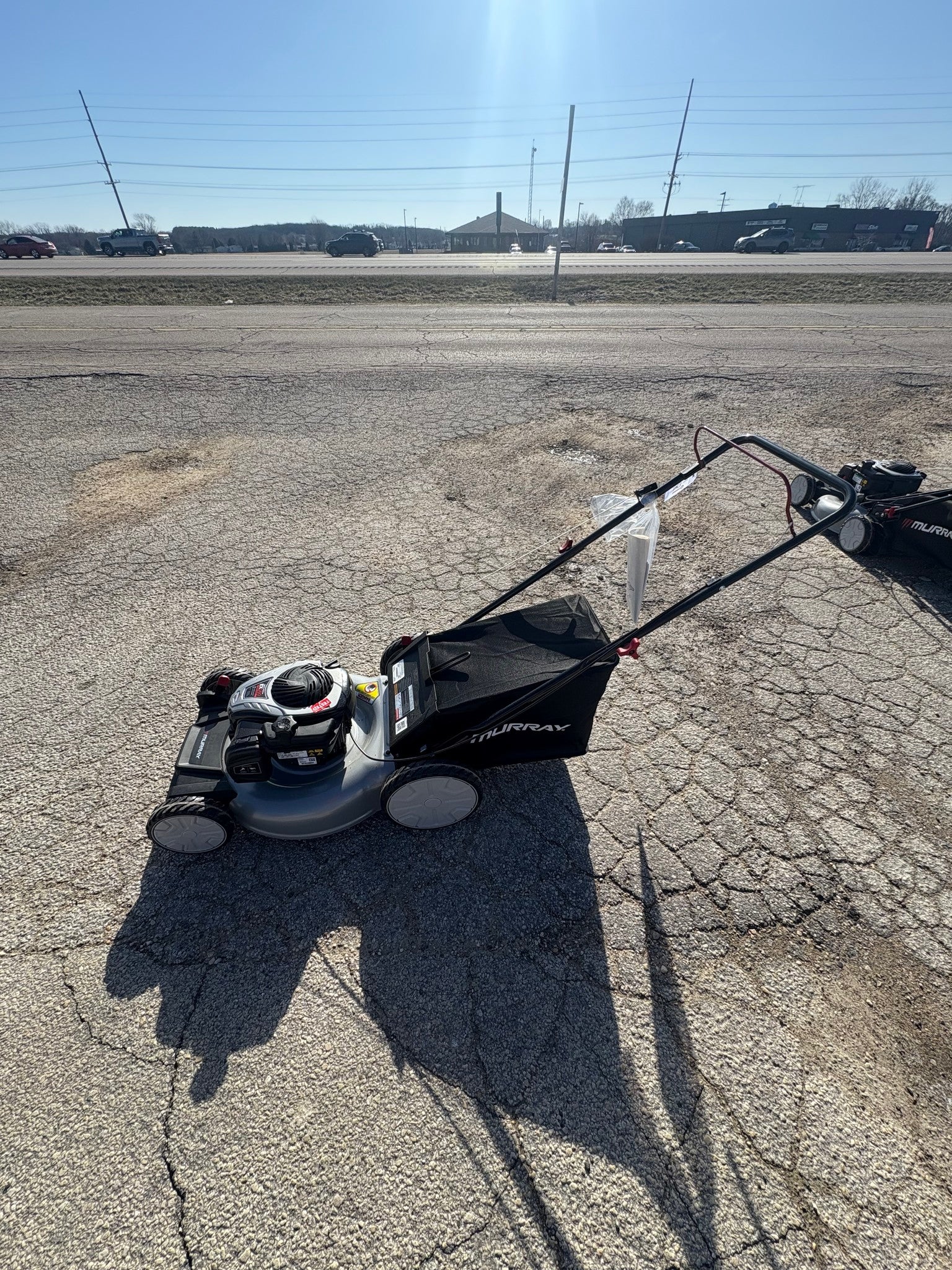 Murray 21 in. 140 cc Briggs and Stratton Walk Behind Gas Push Lawn Mower with Height Adjustment and with Mulch Bag.