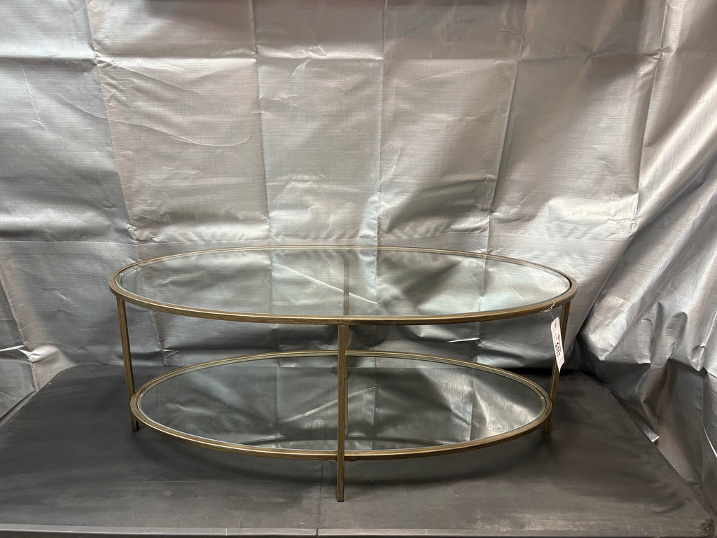 Brand new and fully assembled Home Decorators Collection Bella Large Oval Antique Bronze Metal and Glass Coffee Table with Shelf (46 in. W x 18 in. H)