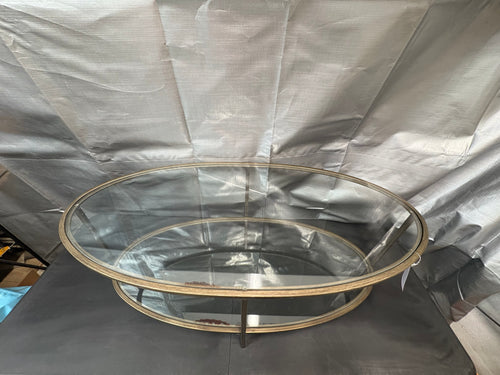 Brand new and fully assembled Home Decorators Collection Bella Large Oval Antique Bronze Metal and Glass Coffee Table with Shelf (46 in. W x 18 in. H)