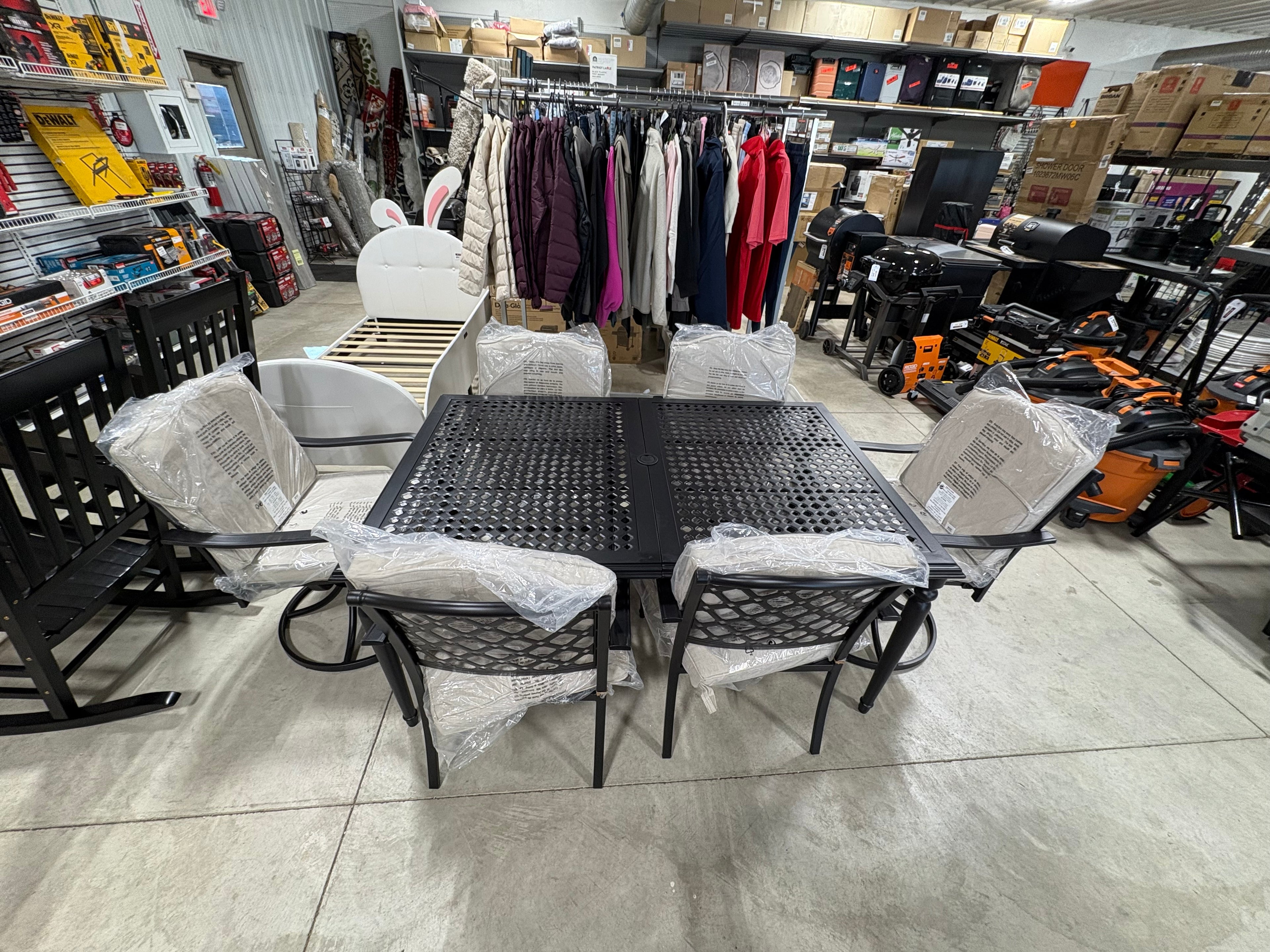 Brand new and fully assembled Hampton Bay Laurel Oaks 7-Piece Dark Brown Steel Outdoor Patio Dining Set with Cushion Guard Putty Cushions