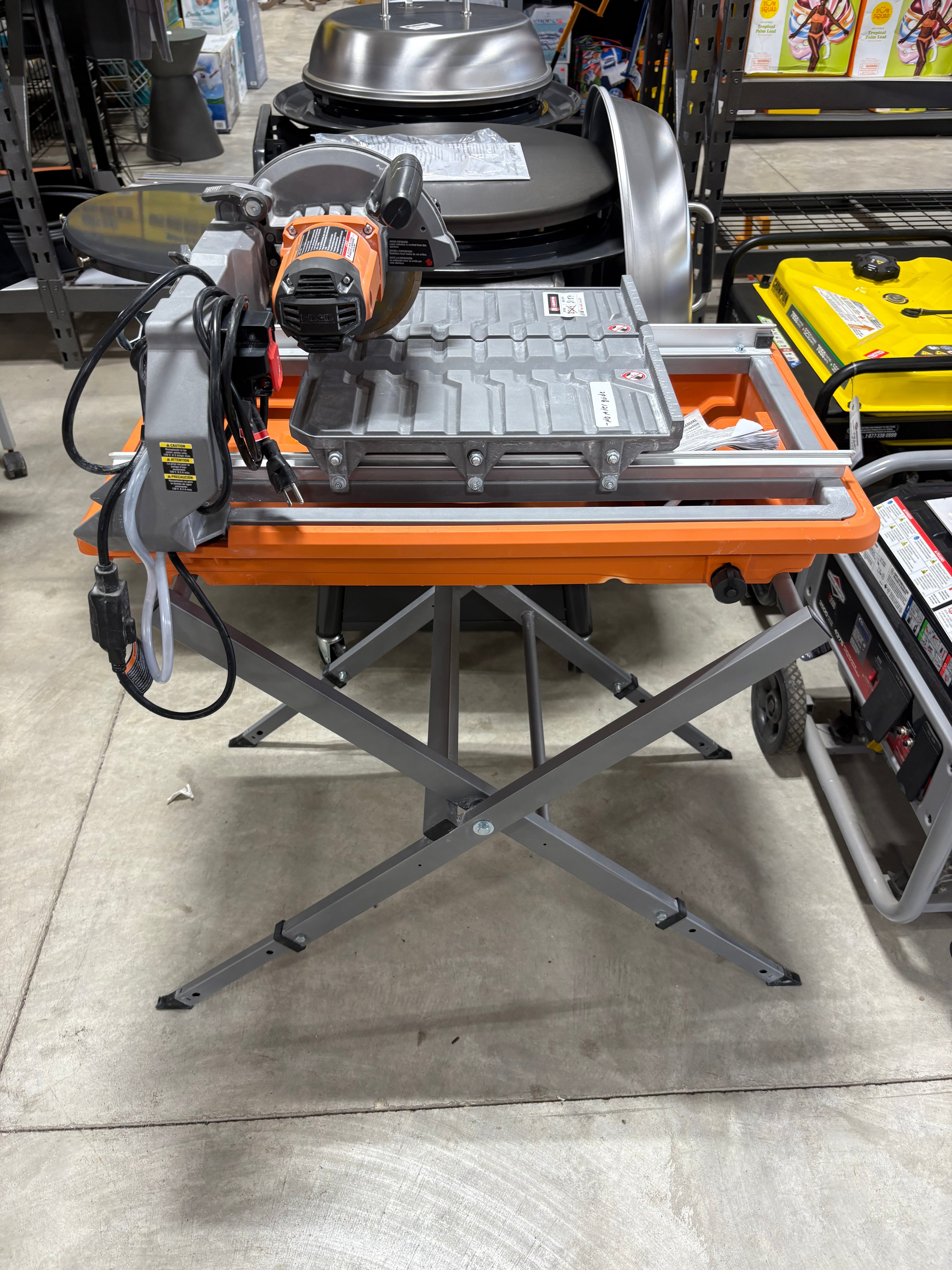 Lightly Used RIDGID 9-Amp 7 in. Blade Corded Wet Tile Saw with Stand.